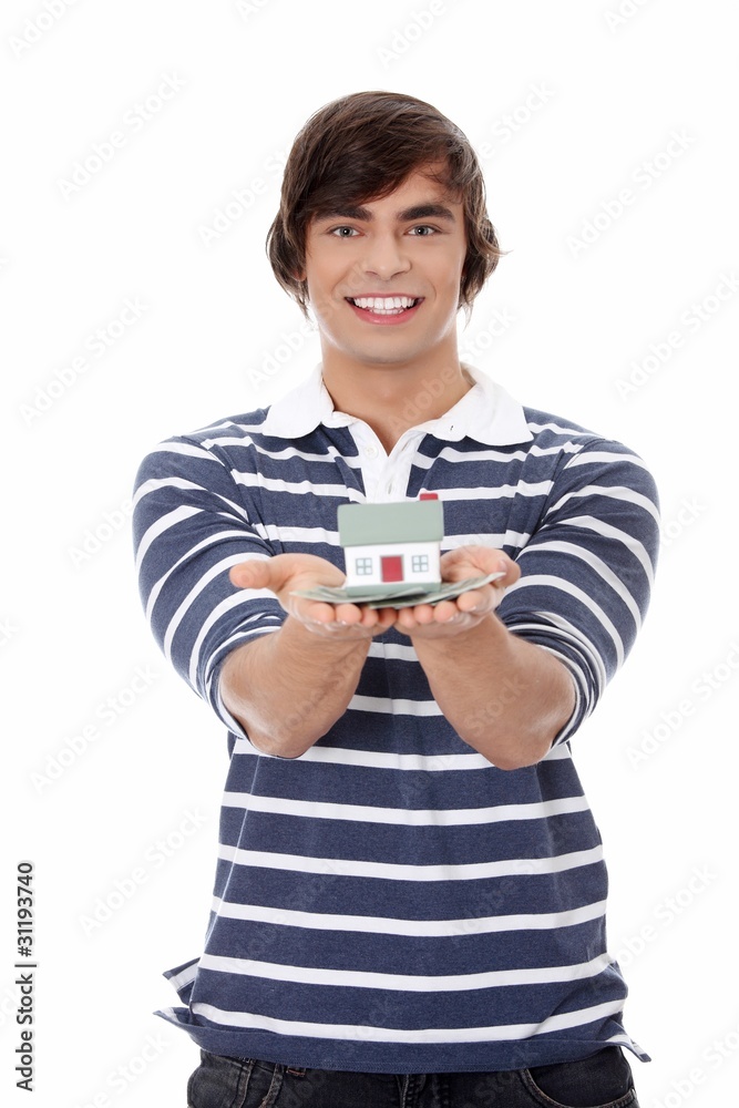 Young man with money and house's model. Young man with money and house's model.