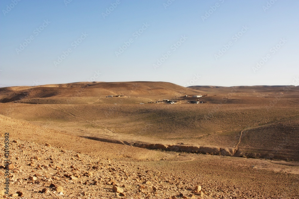 Desert mountains and a Bedouin village