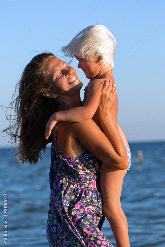 Mother and son on a background of sea Mother and son on a background of sea