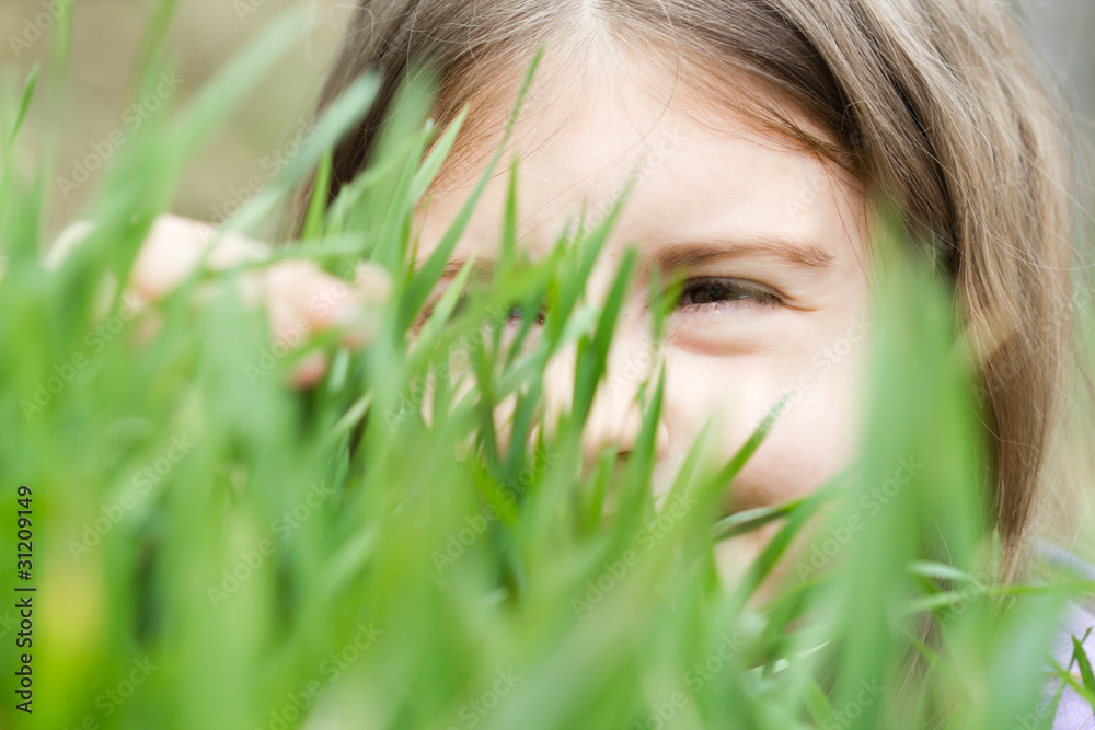closeup portrait of little girl on green grass closeup portrait of little girl on green grass