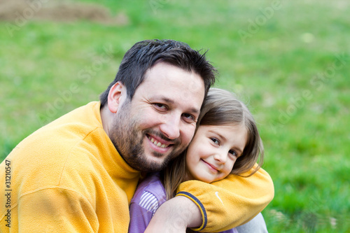 Father playing with his daughter in the park