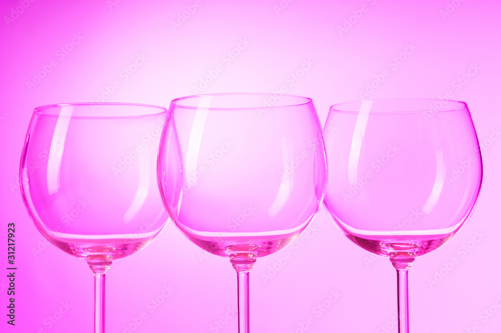 Wine glasses against gradient background Wine glasses against gradient background
