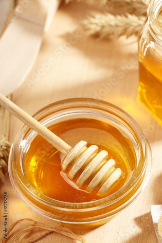 Honey with wood stick