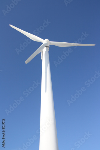 Windmill against blue sky