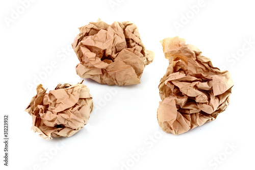 Brown crumpled paper balls isolated on white
