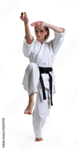 Karate. Young girl in a kimono