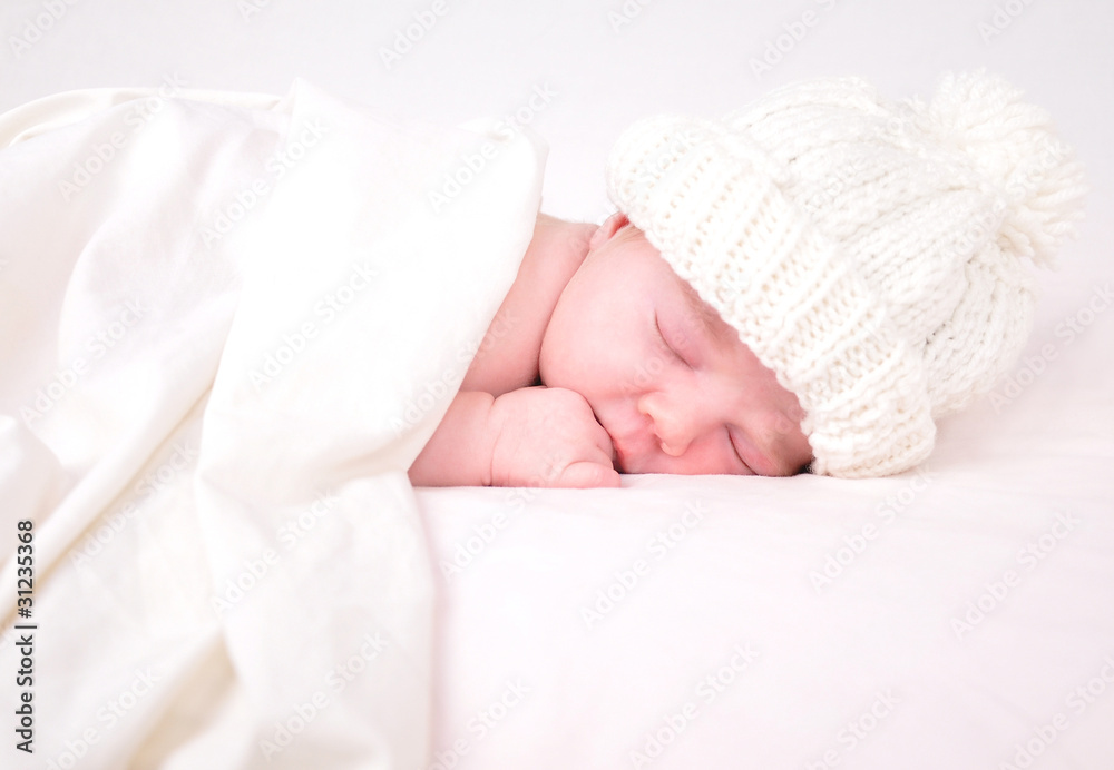 Little Newborn Baby Sleeping on White with Blanket