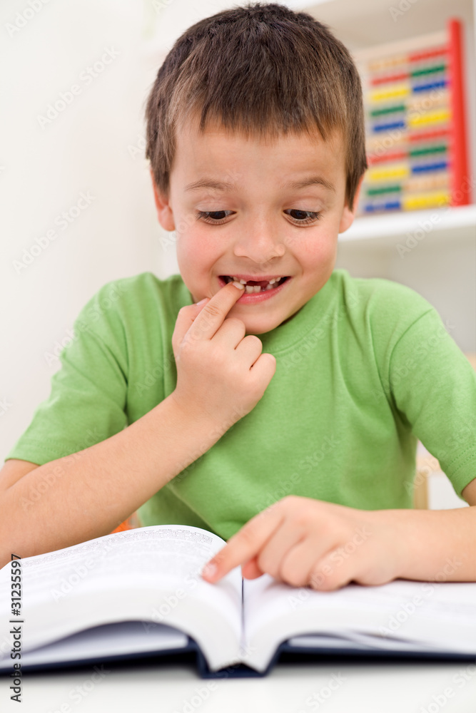 School boy with reading problems School boy with reading problems
