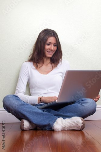 Beautiful Girl With Laptop At Home