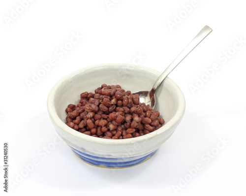Cooked aduki beans in bowl with spoon