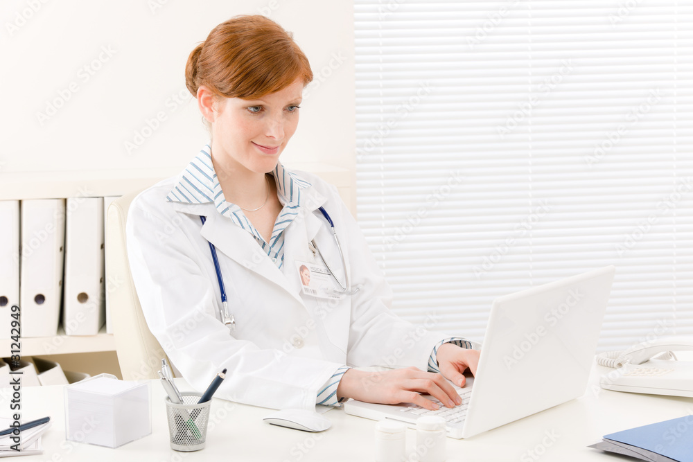 Doctor office - female physician work computer Doctor office - female physician work computer