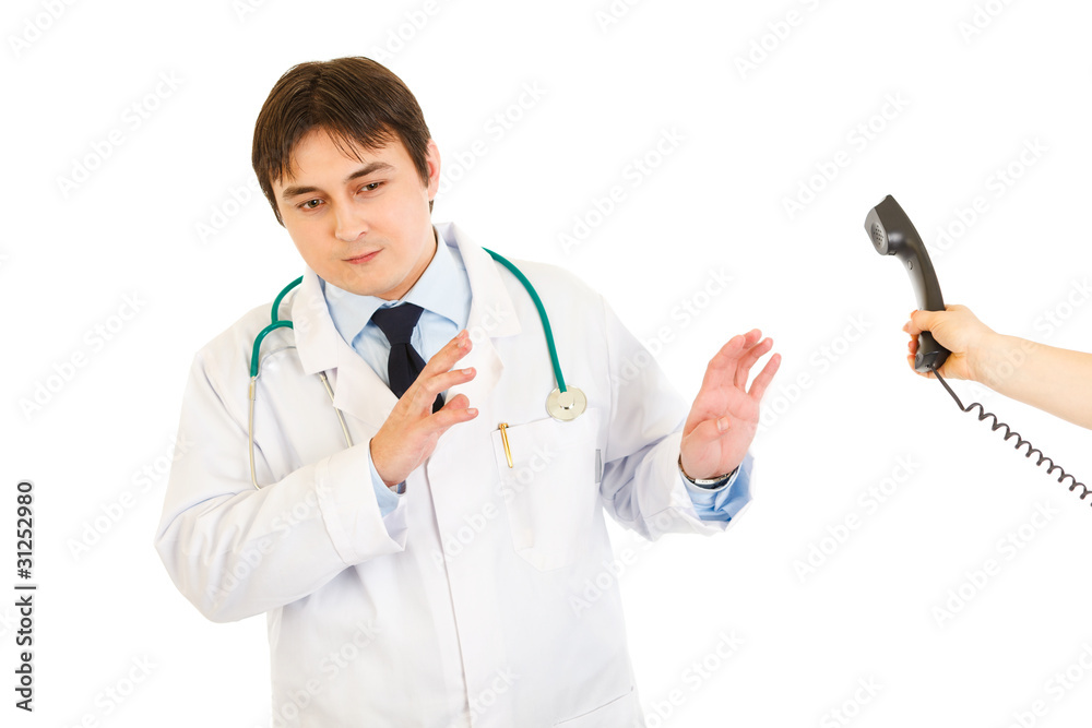 Very busy medical doctor refusing answer on phone call Very busy medical doctor refusing answer on phone call