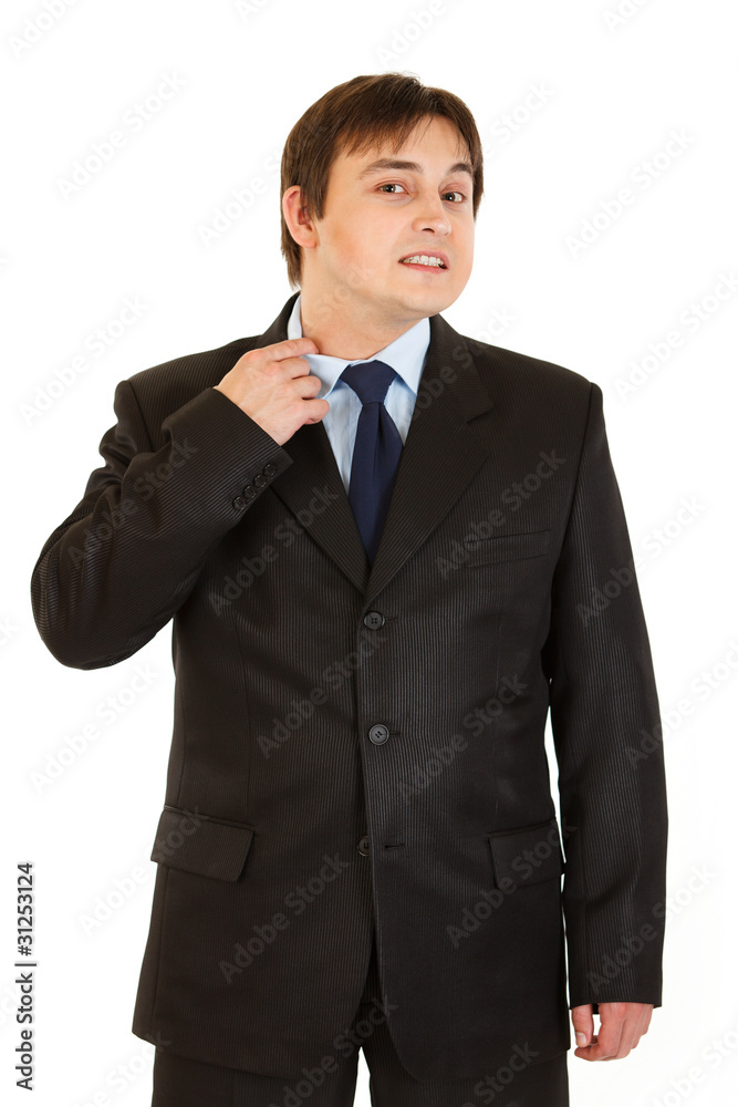 Stressful businessman pulling collar of his shirt isolated Stressful businessman pulling collar of his shirt isolated