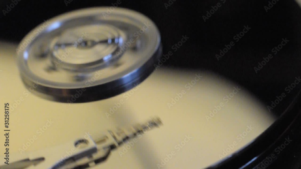 Closeup of a hard drive disk spanning Closeup of a hard drive disk spanning