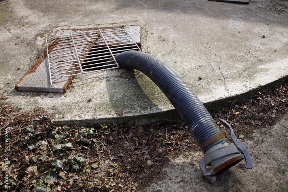 Güllegrube mit Schlauch StockFoto Adobe Stock