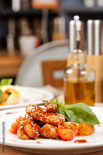 Wallpaper Mural portion of sesame chicken served on a white plate Torontodigital.ca