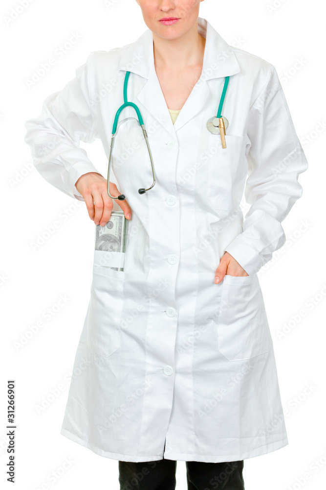 Medical doctor putting money in pocket robe. Close-up. Medical doctor putting money in pocket robe. Close-up.
