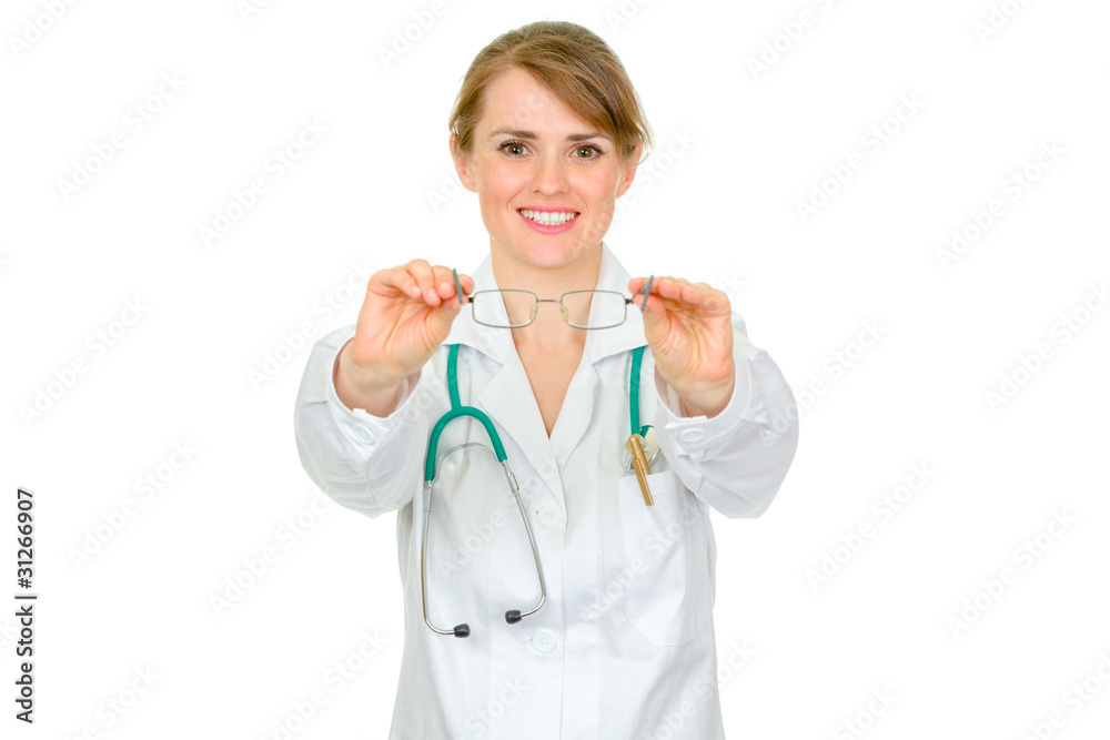 Smiling oculist female giving glasses isolated on white. Smiling oculist female giving glasses isolated on white.