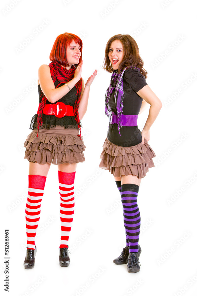 Pretty teen girl admiringly applauding her pleased girlfriend Pretty teen girl admiringly applauding her pleased girlfriend