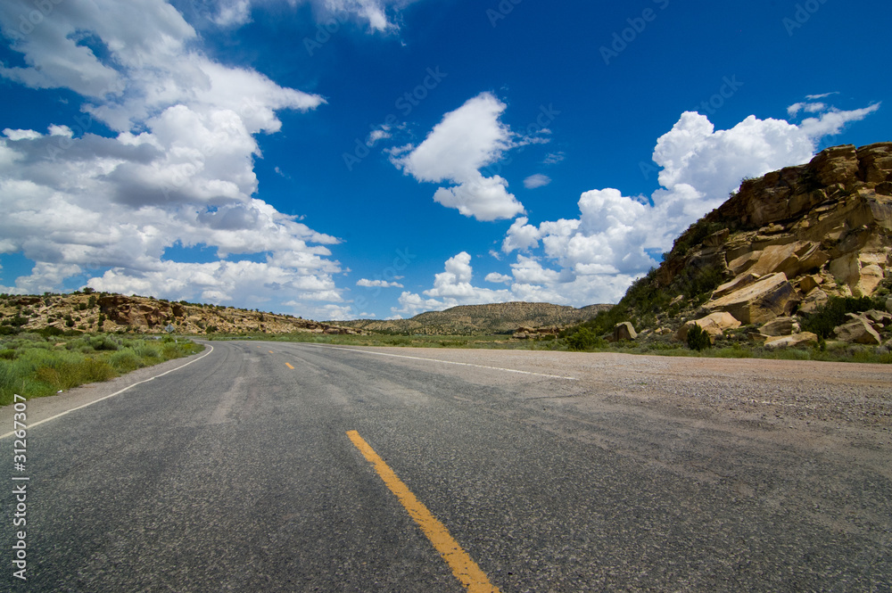 American road curving through rocky terrain