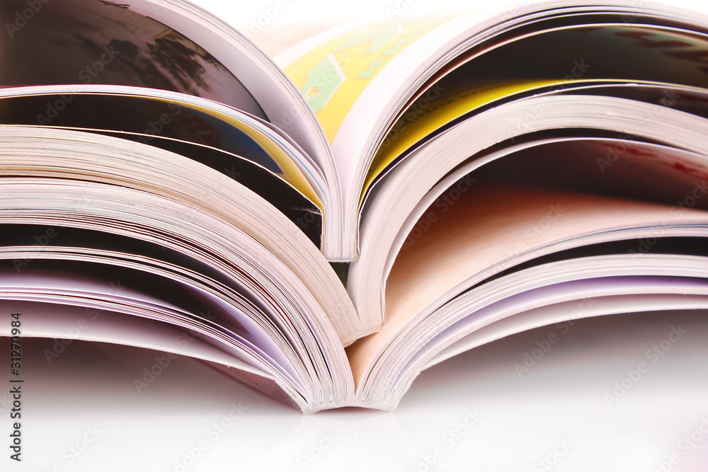 Pile of open magazines isolated on white background Pile of open magazines isolated on white background