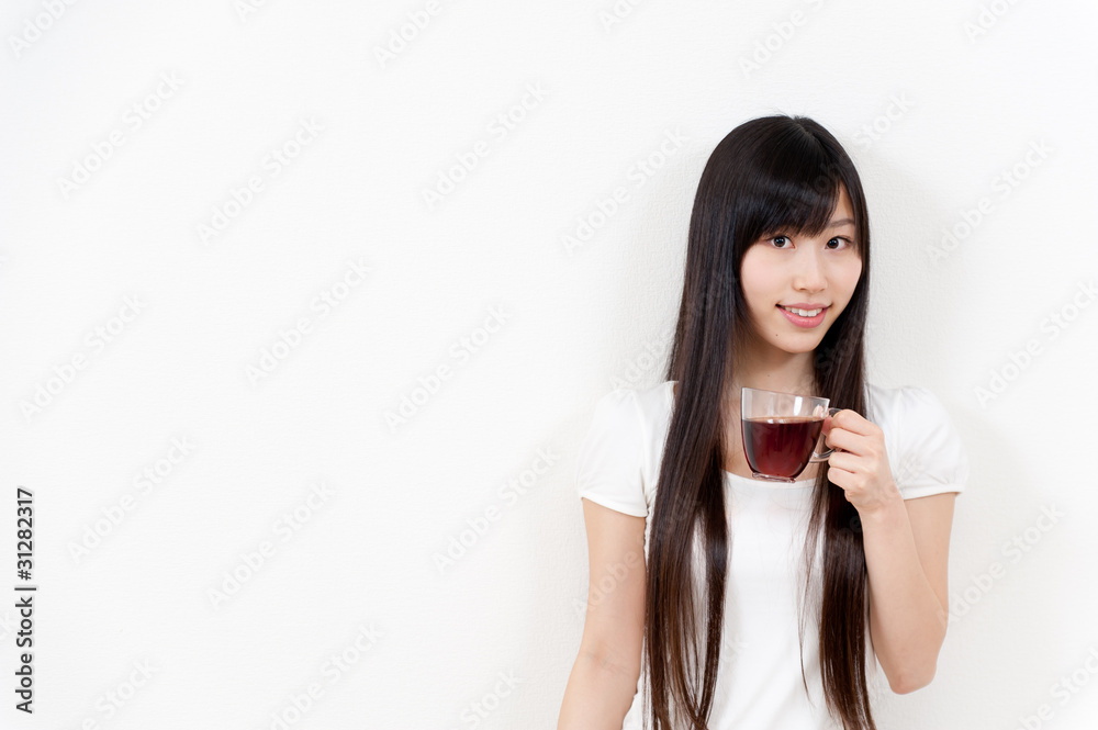 beautiful asian woman with a cup of tea beautiful asian woman with a cup of tea
