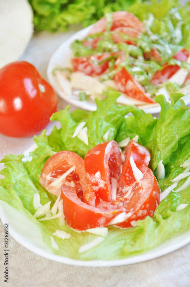 Tomatoes with mayonnaise on lettuce leaf Tomatoes with mayonnaise on lettuce leaf