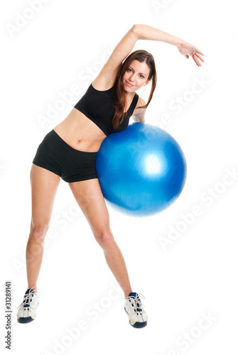 Fitness woman posing with fitness ball