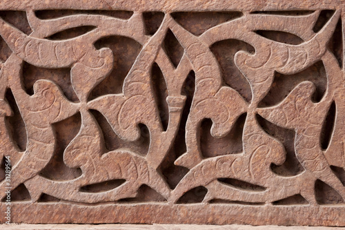 Close up of red stone carving at Qut'b Minar in Delhi.