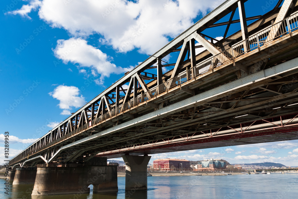 Angle view of a rusty bridge against blue sky Angle view of a rusty bridge against blue sky