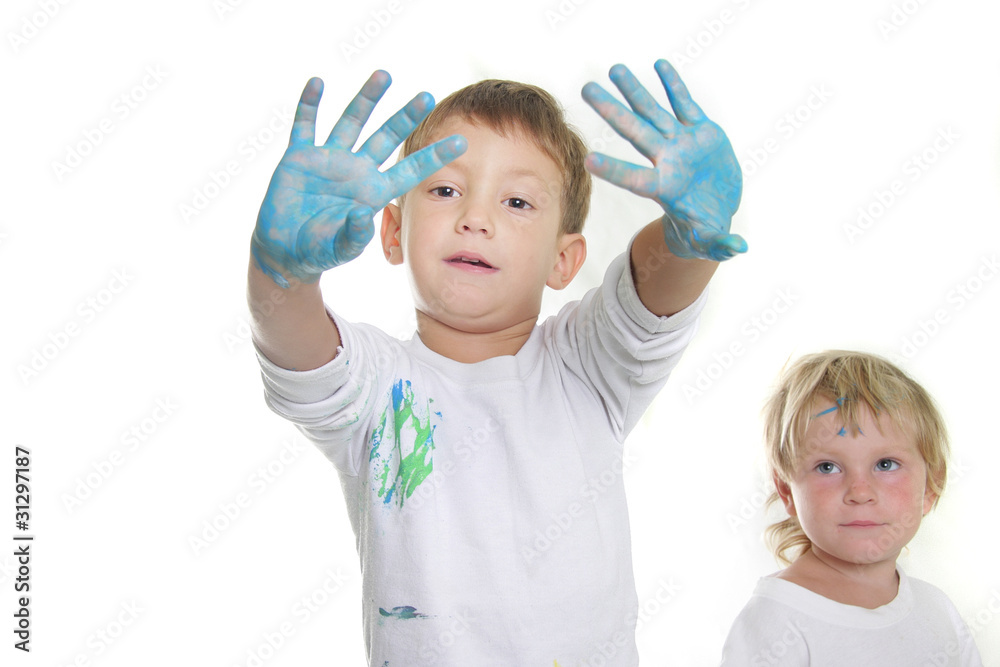two children painting over white