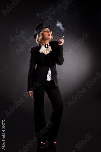 Young Woman In Fashionable Clothing With A Cigarette © Fotoskat