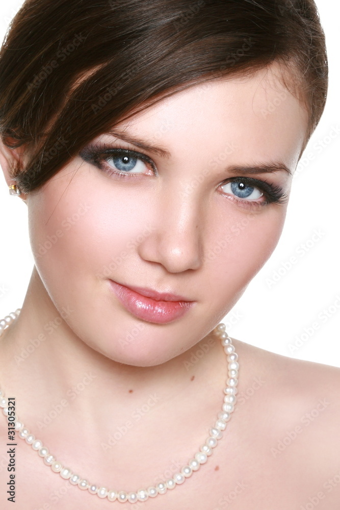Young brunette lady. Close-up portrait on white background