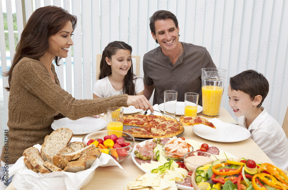 Parents Children Family Eating Pizza & Salad At Dining Table