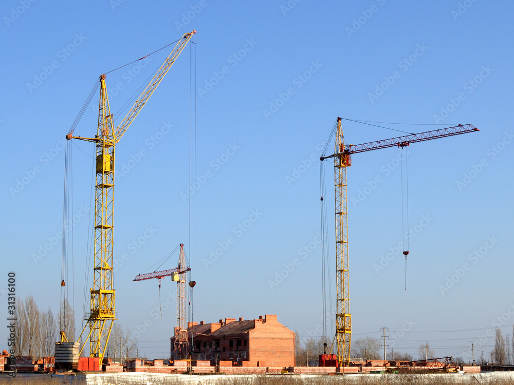 Cranes and building under construction