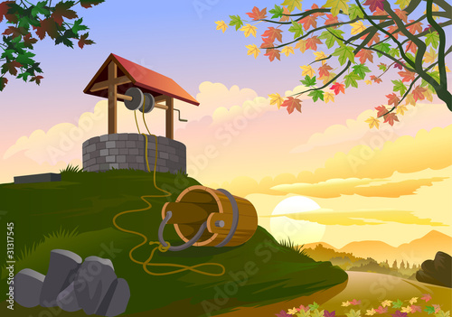 TRADITIONAL WELL AND BUCKET ON HILLSIDE