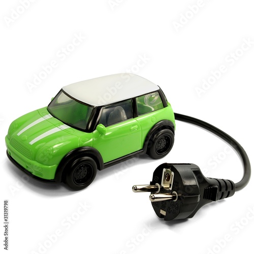 Grünes Elektroauto mit Stecker photo