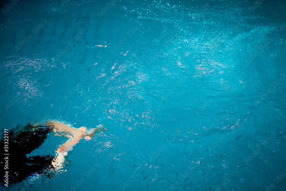 swimming in blue pool
