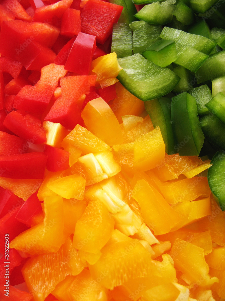 Yellow, red and green peppers Bulgarian. Slicing. Cubes