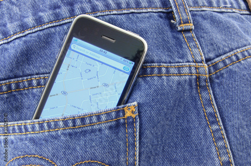 Smartphone with GPS navigator in blue jean pocket