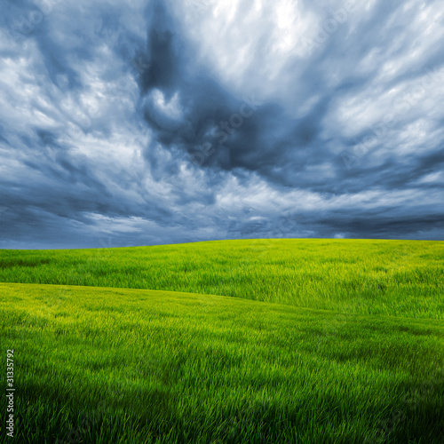 storm cloud over grass field