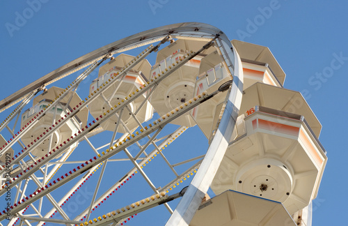 Retro Ferris Wheel Against Blue Sky