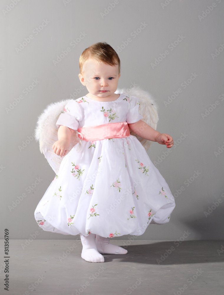 little girl in an elegant dress with wings of an angel little girl in an elegant dress with wings of an angel