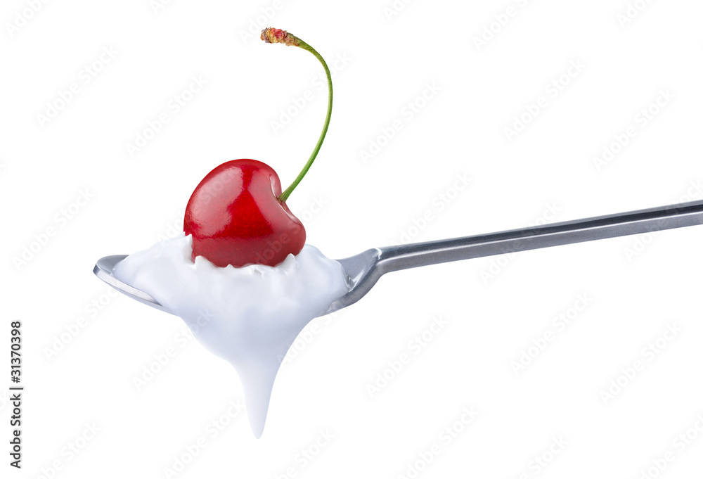 Isolated yogurt. Spoon of natural yogurt with cherry on top isolated on white background Isolated yogurt. Spoon of natural yogurt with cherry on top isolated on white background