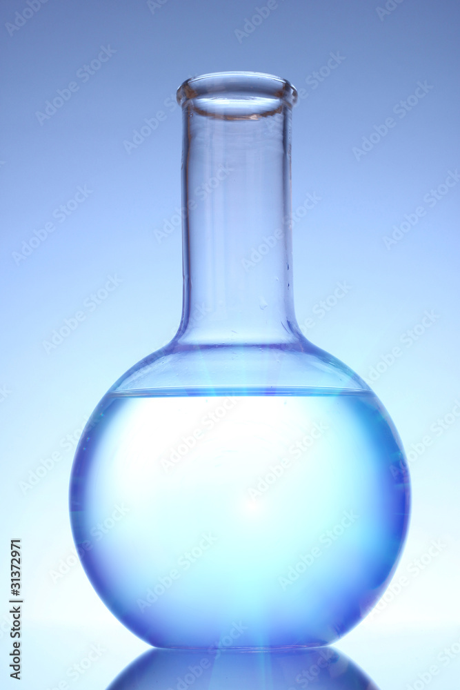 Flask with liquid on blue background Flask with liquid on blue background