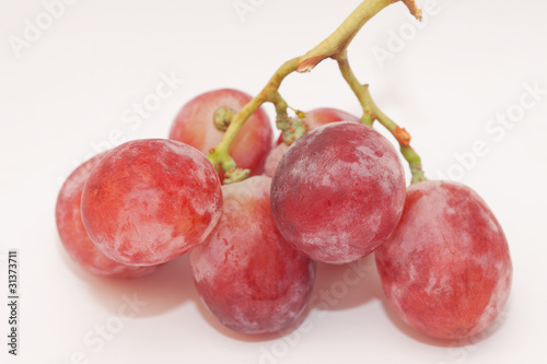 red grapes on white