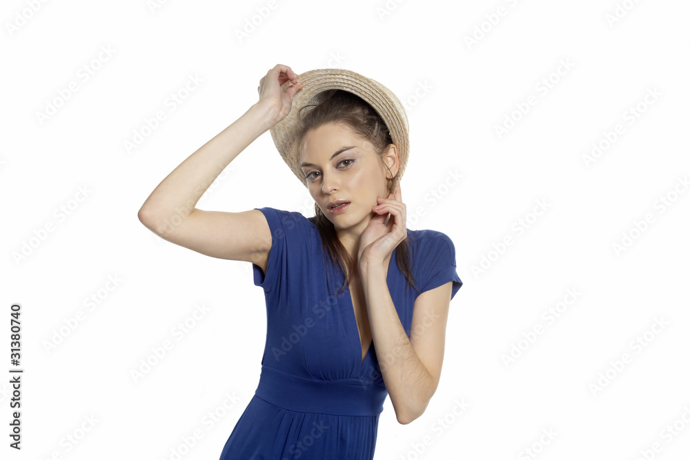 Girl fitting straw cap