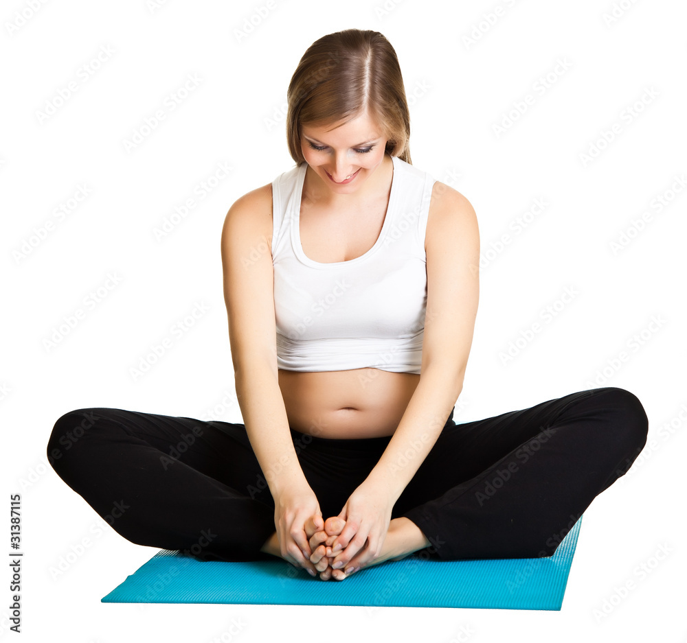 Fototapeta premium Pregnant woman fitness isolated on white