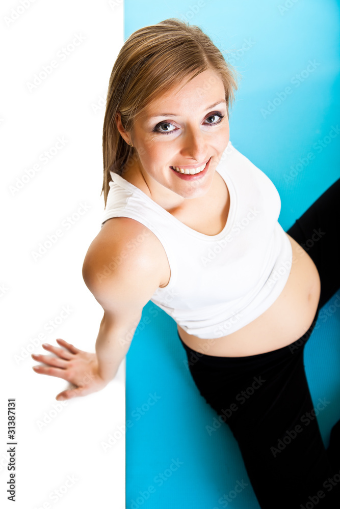 Pregnant woman fitness isolated on white
