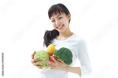 野菜を持った女性